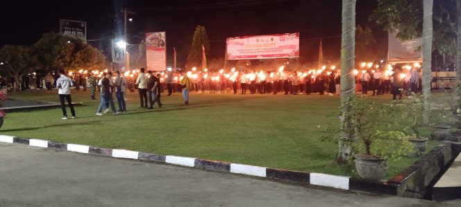 
					Kapolres Kampar Pimpin Upacara Taptu dan Wabup Lepas Pawai Obor di Mapolres